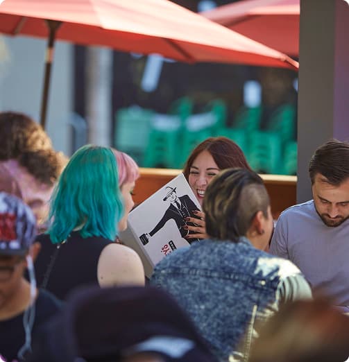 Friends enjoying outdoor dining at the street fair